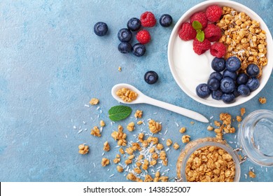 High Protein And Diet Breakfast. Homemade Granola Crisp With Raspberry, Blueberry And Greek Yogurt. Top View.