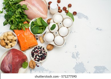 High protein food - fish, meat, poultry, nuts, eggs. Products goof for healthy hair. Space for text - Shutterstock ID 571277590