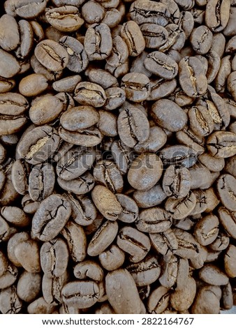 High quality aromatic roasted coffee beans pattern. Freshly roasted coffee bean backdrop for cafe design.