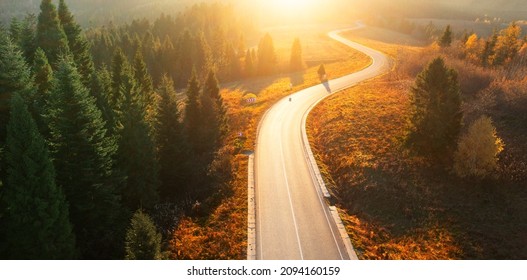 High quality asphalt road in the mountains. With markings and road infrastructure at sunset. - Powered by Shutterstock