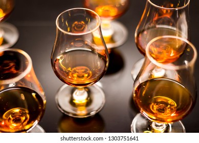 High quality Caribbean rum in modern glass for tasting  - Shutterstock ID 1303751641
