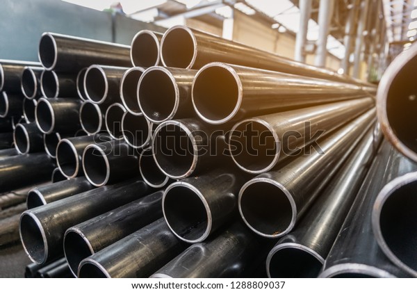 high\
quality Galvanized steel pipe or Aluminum and chrome stainless\
pipes in stack waiting for shipment  in\
warehouse