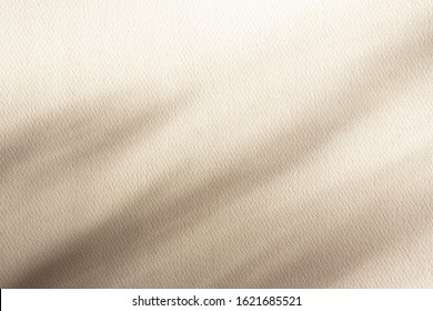 High quality paper textured background with shadows, light pastel beige color. Overlay effect for photo, cards, posters, stationary, wall art, design presentation. Copy space, close up view.