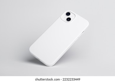 high quality starlight color iPhone 14 Plus case mock up, smart phone in white silicone case falls down, back view isolated on gray background