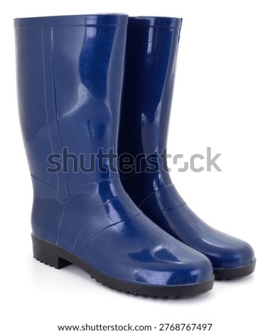 A high quality studio shot of a pair of shiny blue waterproof wellies. Authentic photography, real camera capture, high quality natural shot created without AI tools.
