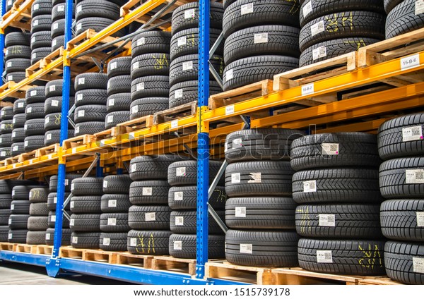 High rack with customer tires in a warehouse of\
a motor vehicle workshop