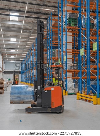High Rack Stacker Forklift Driver in Distibution Warehouse Fulfilment Center