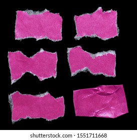 high res macro photo of cool pink paper stickers isolated on black background with tears or snags and folds, set of teared sticky tapes