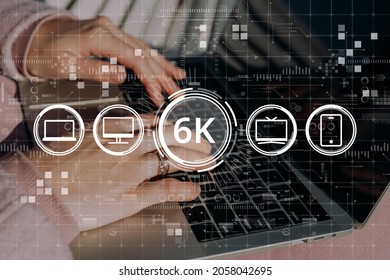 High resolution 6k concept on abstract image with hands and laptop with icons computer, tv and smartphone icons.