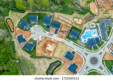 High Resolution Aerial Picture Of A New American Residential Real Estate Development Cul-de-sac  Single Family Homes Built, Under Construction And Home Sites For Sale, Traffic Circle, Community Pool