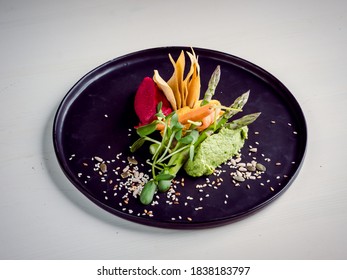 High Resolution Avocado Sorbet With A Flower Decoration And Seasoning, A Restaurants Dish