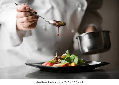 High resolution image of a chef putting sauce on dish - Powered by Shutterstock