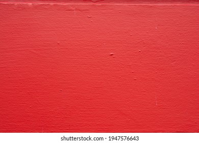 A high resolution image of a red wooden board.