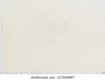 High resolution large image of an uncoated weathered textbook cover paper with square spiral holes wavy root like texture copy space for text for presentation background or high quality wallpaper