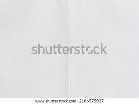 High resolution large image of white paper texture background scan folded in half, soft fine grain uncoated paper for water colors with copy space for text material mockup or presentation wallpaper