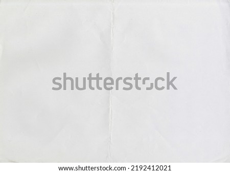 High resolution large image of white paper texture background scan folded in half, soft fine grain uncoated paper for water colors with copy space for text material mockup or presentation wallpaper