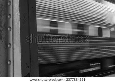High resolution long exposure image of a moving CTA Metra train passing through on of Chicago's Stations