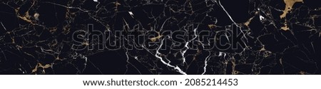 High resolution. Luxury abstract fluid art painting in alcohol ink technique, mixture of black, gray and gold paints. Imitation of marble stone cut, glowing golden veins. Tender and dreamy design