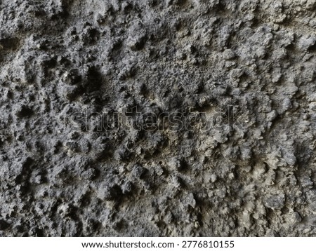 High resolution macro of dark grunge concrete wall texture. seamless industrial background for design, 3D, poster or video overlay. Detailed rough surface 