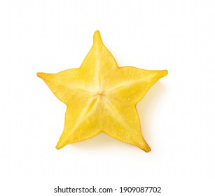 High resolution macro shot of ripe juicy carambola starfruit slice isolated on white background. Ready to eat vegetarian healthy eating. Slimming diet low calorie ingredient. Studio shot.