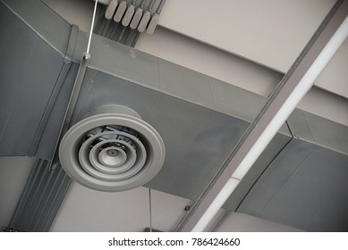 High Resolution Photo Of Circular Air Duct And Ventilation Pipe Of Air Conditioning System (HVAC) Hanging From Ceiling Inside Building. Danger And The Cause Of Respiratory Diseases In Office Staff.