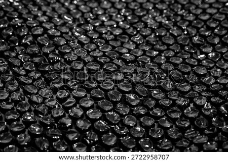 High Resolution Plastic Bubble Wrap Texture. black plastic buble wrap background