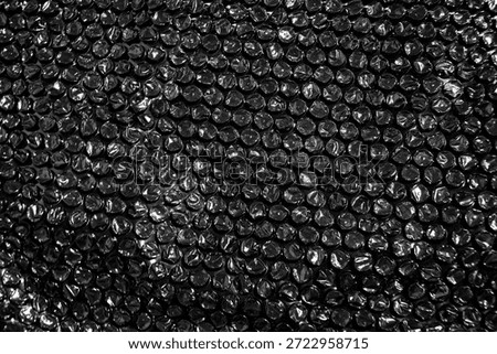 High Resolution Plastic Bubble Wrap Texture. black plastic buble wrap background