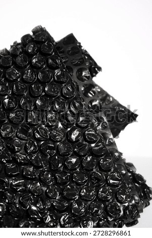 High Resolution Plastic Bubble Wrap Texture. black plastic buble wrap background