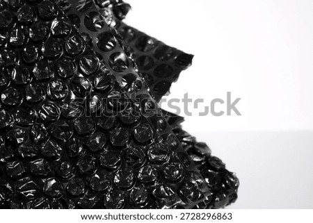 High Resolution Plastic Bubble Wrap Texture. black plastic buble wrap background