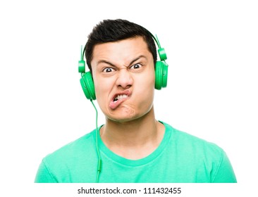 High Resolution Portrait Crazy Asian Man Pulling Funny Faces Wearing Headphones Isolated On Clean White Background