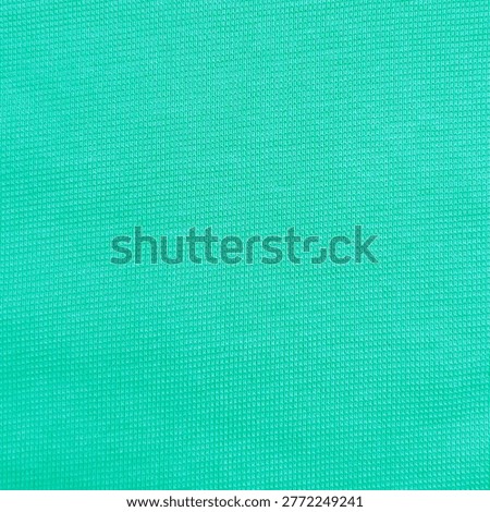 High resolution seamless macro of vibrant teal green aqua turquoise pk polo pique knit fabric texture. 4000px premium cotton pique textile for polo shirts, golf wear, summer apparel and commercial branding