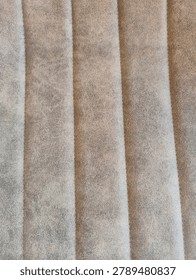 High Resolution Seamless PBR Texture of Fluted Greige Nubuck Leather, Vertical Ribbed Distressed Faux Suede Wall Covering Albedo Map for Luxury Interior Archviz Design
