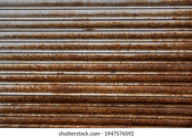 A high resolution shot of a rusty rolling shutter.