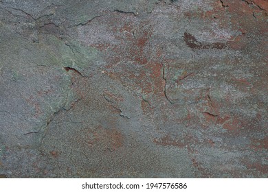 A high resolution shot of some cracked, blue and red stone.