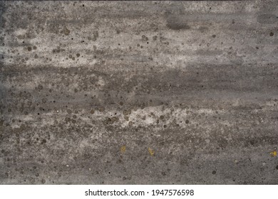 A high resolution shot of some dirty, weathered stone.