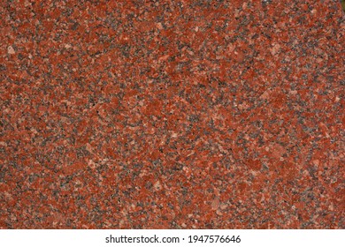 A high resolution shot of some weathered red marble.