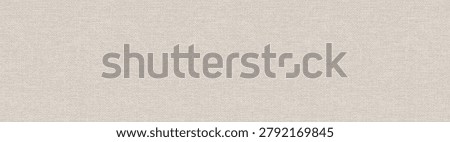 A high resolution texture of a seamless light beige canvas fabric banner with copy space.