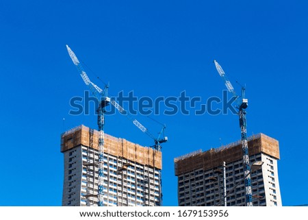 High rise condominium construction with blue sky