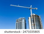 High rise condominium construction with a building crane in Vancouver, British Columbia, Canada.