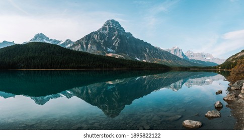 High Rocky Mountain With Nicely Calm Water Reflection In A Crystal Clear Lake