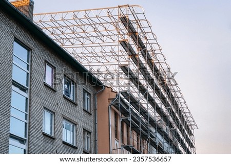 High scaffold for temporary roof being erected around a building, to allow building works and a re-roof to be carried out Photo stock © 