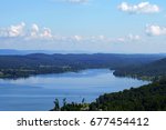 High scenic vista of Lake Guntersville State Park with blue skies and fluffy clouds