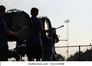 High School Band Members Play During A High School Football Game.