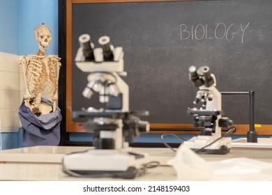 High School Biology Lab. Focus On Chalkboard In The Background