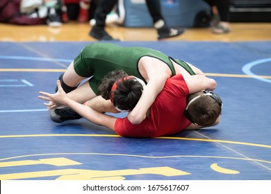 High School Boys Wrestling In A Competitive Match