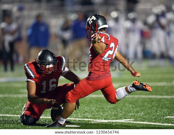 High School Football player in action during a game\
in South Texas