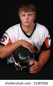 High School Football Player With Jersey And Helmet