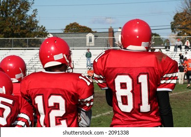 High School Football Team On Sidelines