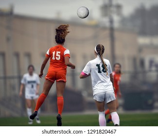 High School girl athletes making amazing plays during a soccer match - Powered by Shutterstock