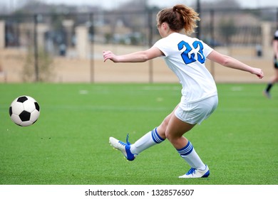 High School Girl Athletes Playing A Varsity High School Soccer Game.